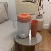 Transparent plastic water bottle, orange cap portable juice bottle, transparent bottle water bottle, orange cap multi-functional plastic bottle, transparent juice water bottle Item Picture